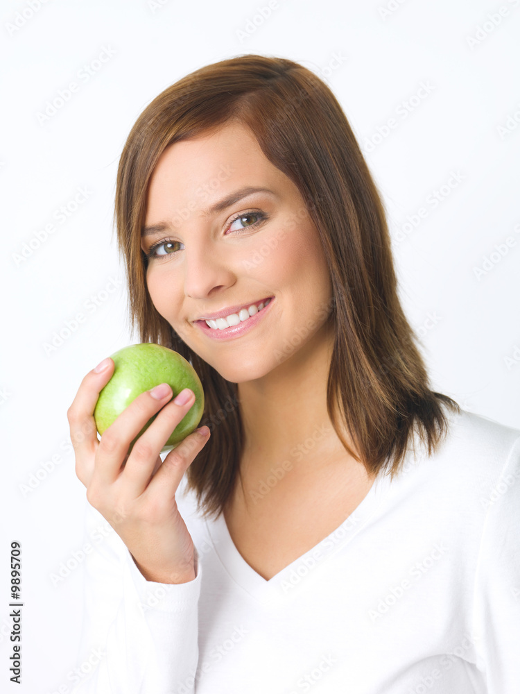 Portrait of beautiful young woman holding green apple Portrait of beautiful young woman holding green apple