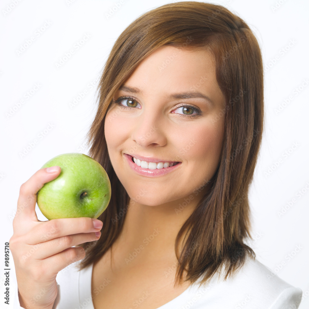 Portrait of beautiful young woman holding green apple Portrait of beautiful young woman holding green apple