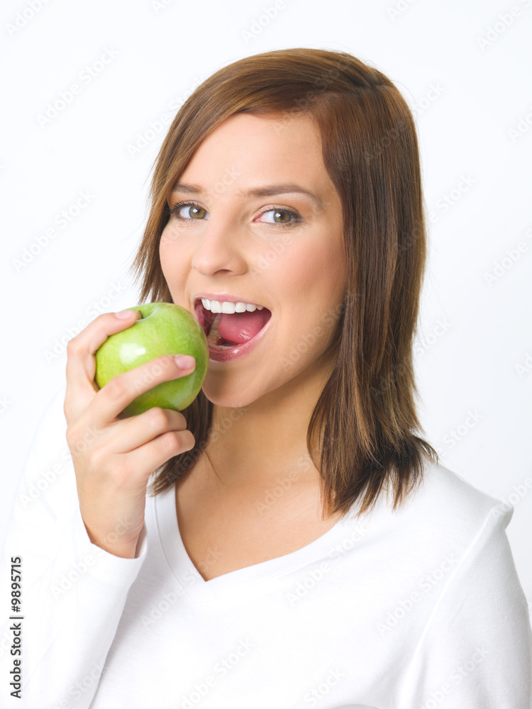 Portrait of beautiful young woman holding green apple Portrait of beautiful young woman holding green apple