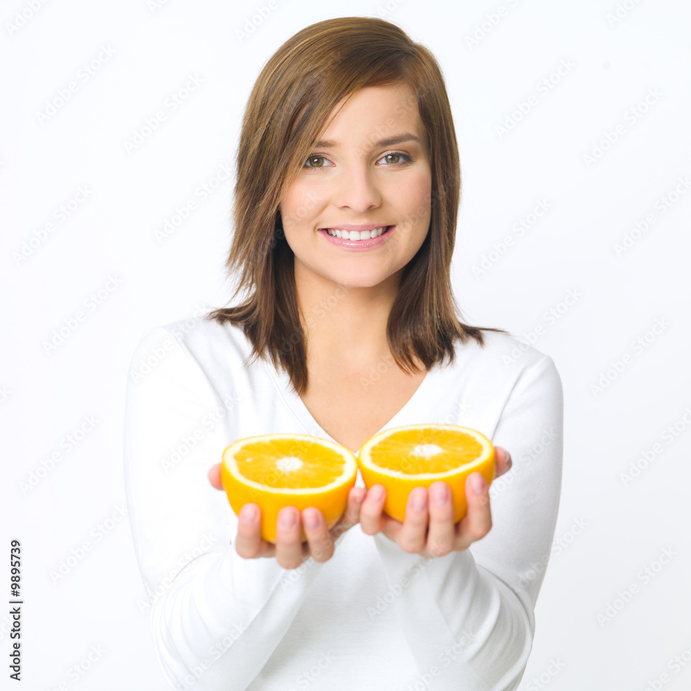 Portrait of beautiful young woman holding fresh orange fruit Portrait of beautiful young woman holding fresh orange fruit
