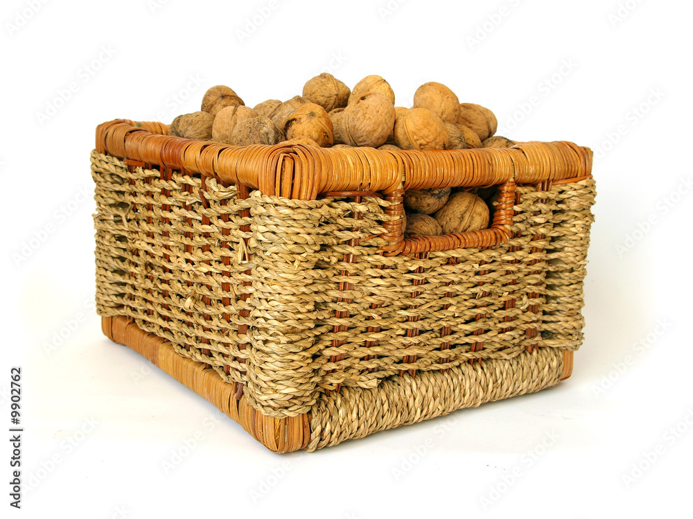 Basket of nuts isolated on white background
