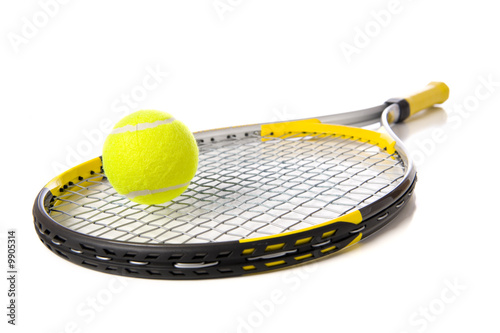 A tennis ball and racket on a white background photo