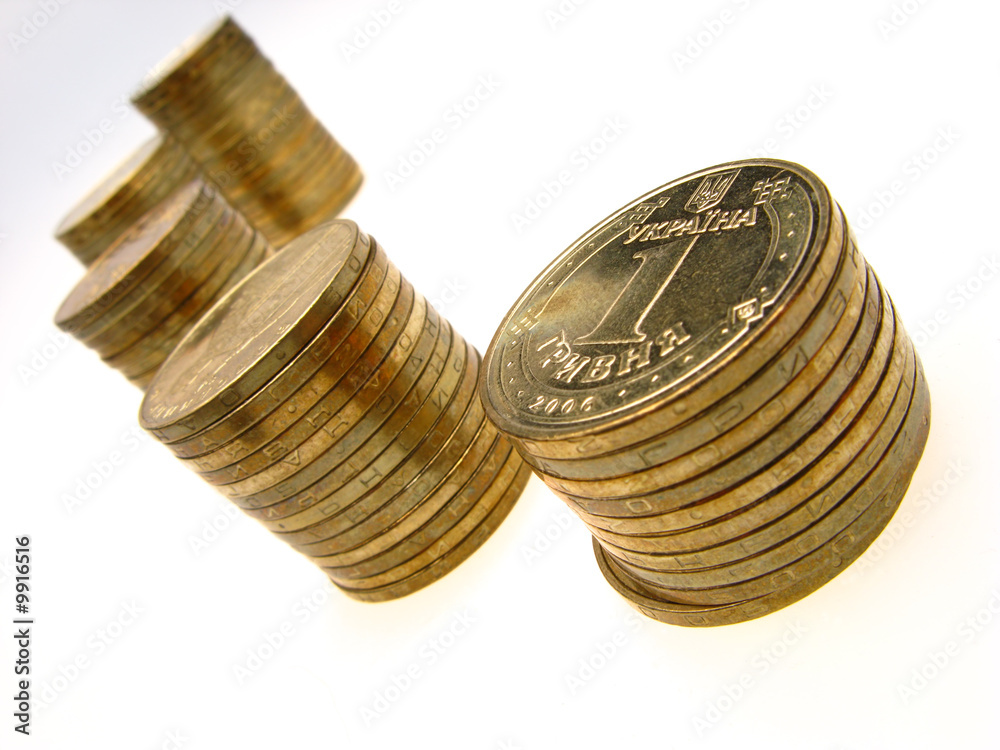 many golden coins, one grivna, close up many golden coins, one grivna, close up