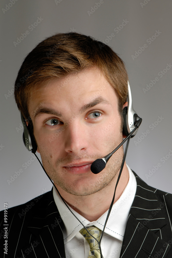 businessman in headphones speaks on microphone businessman in headphones speaks on microphone