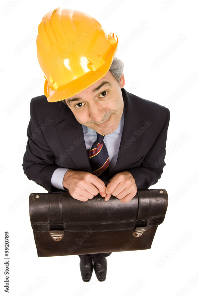 An engineer with yellow hat ans suitcase, isolated on white An engineer with yellow hat ans suitcase, isolated on white