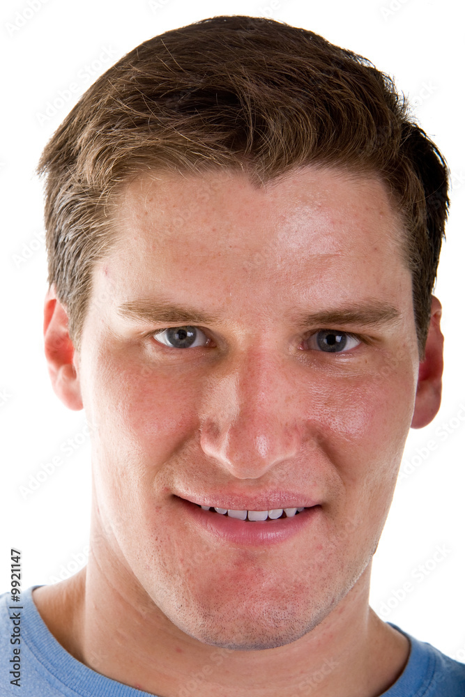 Fototapeta premium A young fit looking man in a closeup on white