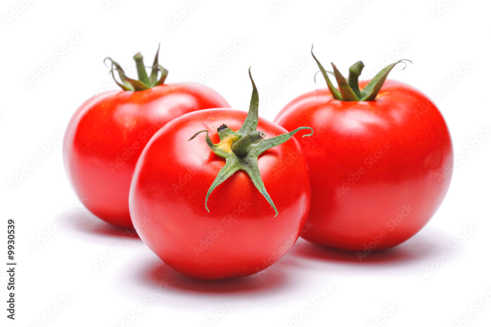 Three tomatoes isolated against white background Three tomatoes isolated against white background