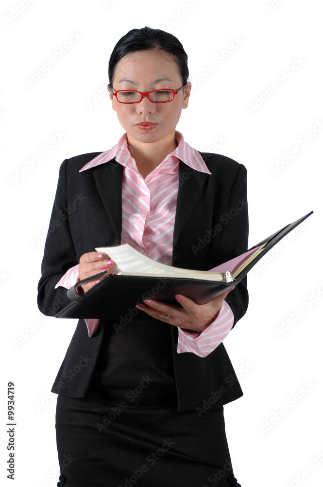 Chinese clerk - checking documents, wearing elegant clothes Chinese clerk - checking documents, wearing elegant clothes