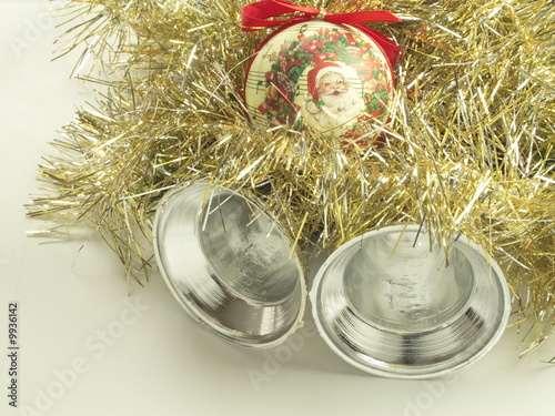 gold and silver tinsel with a santa bauble and silver bells photo