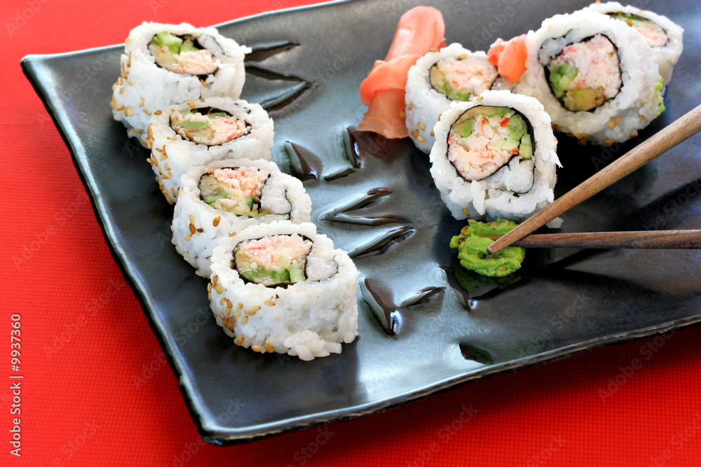 Japanese Sushi on square plate with chopsticks. Japanese Sushi on square plate with chopsticks.