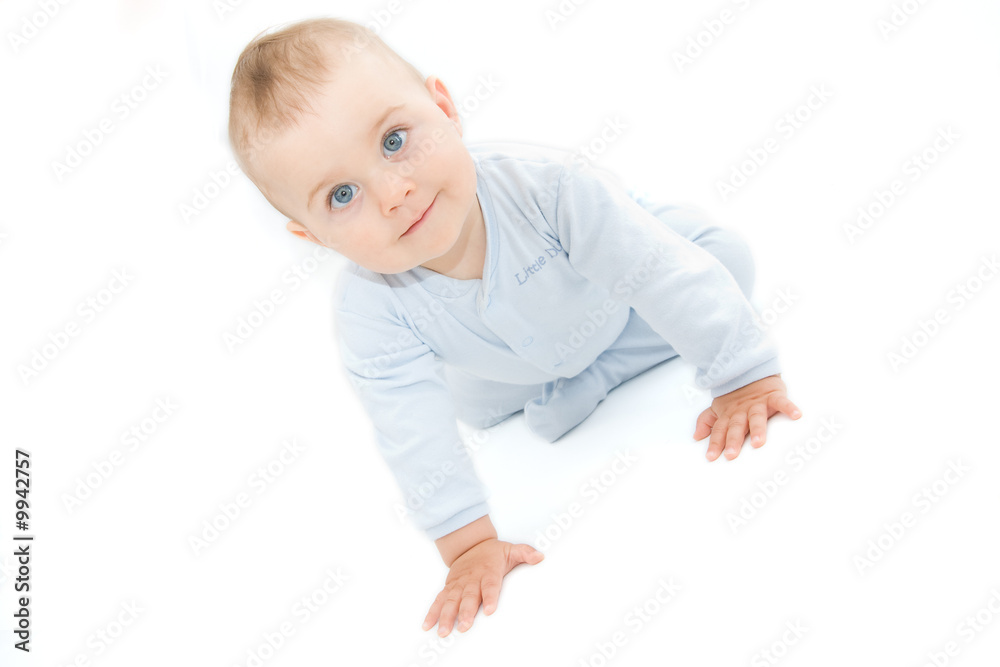 crawling baby boy on bright background