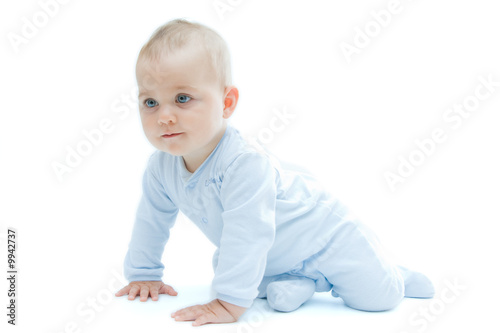 crawling baby boy on bright background