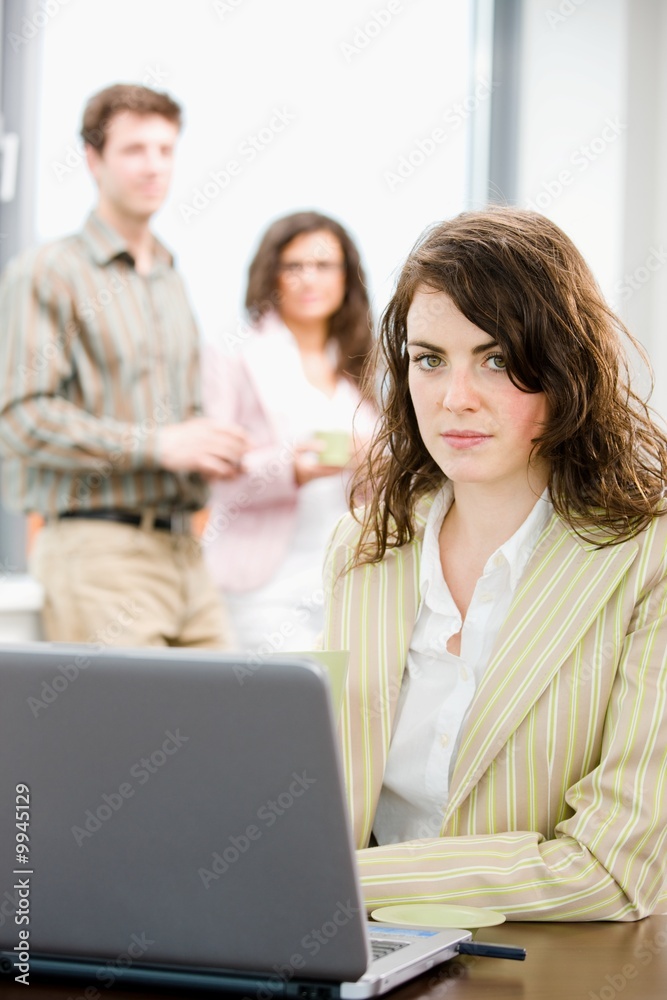 Team of young businesspeople talking and drinking coffee Team of young businesspeople talking and drinking coffee