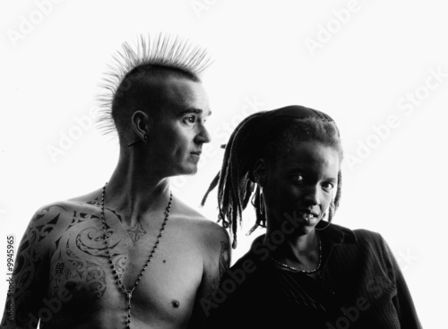 Man with Mohawk and Woman wearing Dreadlocks photo