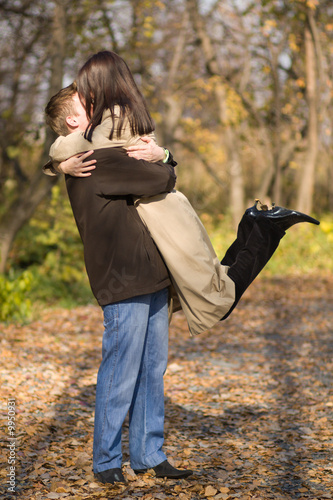 Young couple in love meeting in the autumn park photo