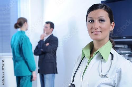 Fotografie Young doctor and staff of hospital
