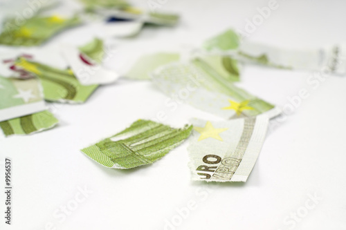Ripped euro banknote on white background.