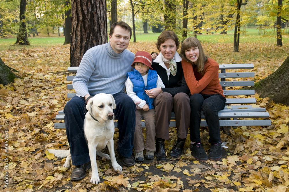 Happy family with dog at autumn time Happy family with dog at autumn time