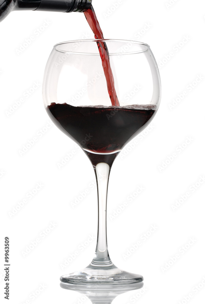 Red wine being poured from bottle into wineglass Red wine being poured from bottle into wineglass