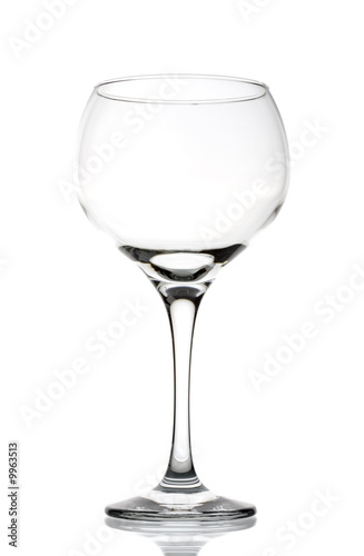 Large clear empty wineglass isolated against white