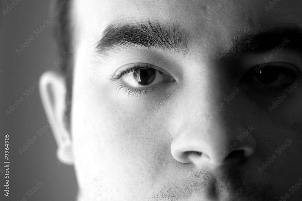Fototapeta premium A young man with a serious look on his face