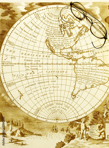 antique map of the western hemisphere with old spectacles