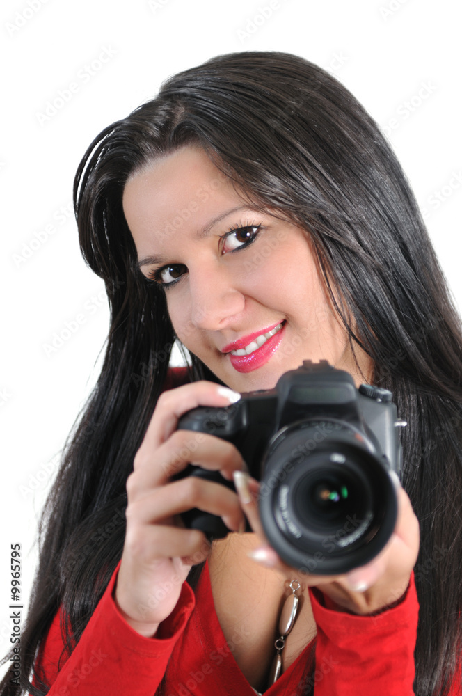 Young woman holding camera in hand taking picture isolated Young woman holding camera in hand taking picture isolated