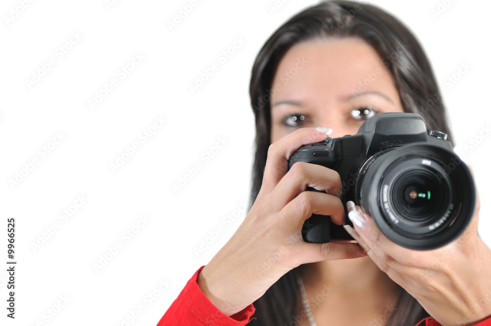 Young woman holding camera in hand taking picture isolated Young woman holding camera in hand taking picture isolated