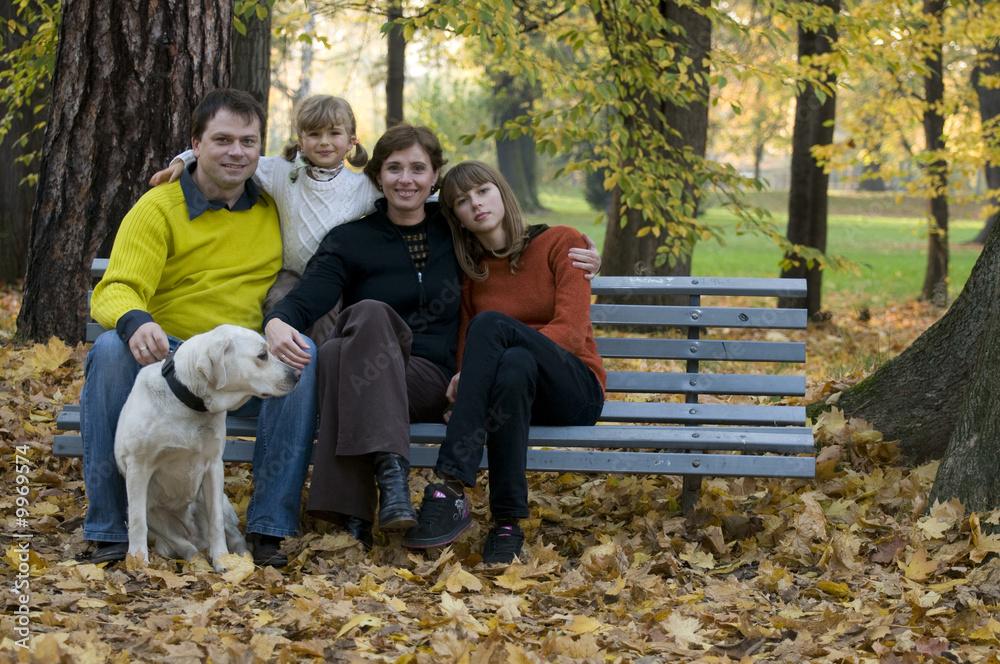 Happy family at autumn time