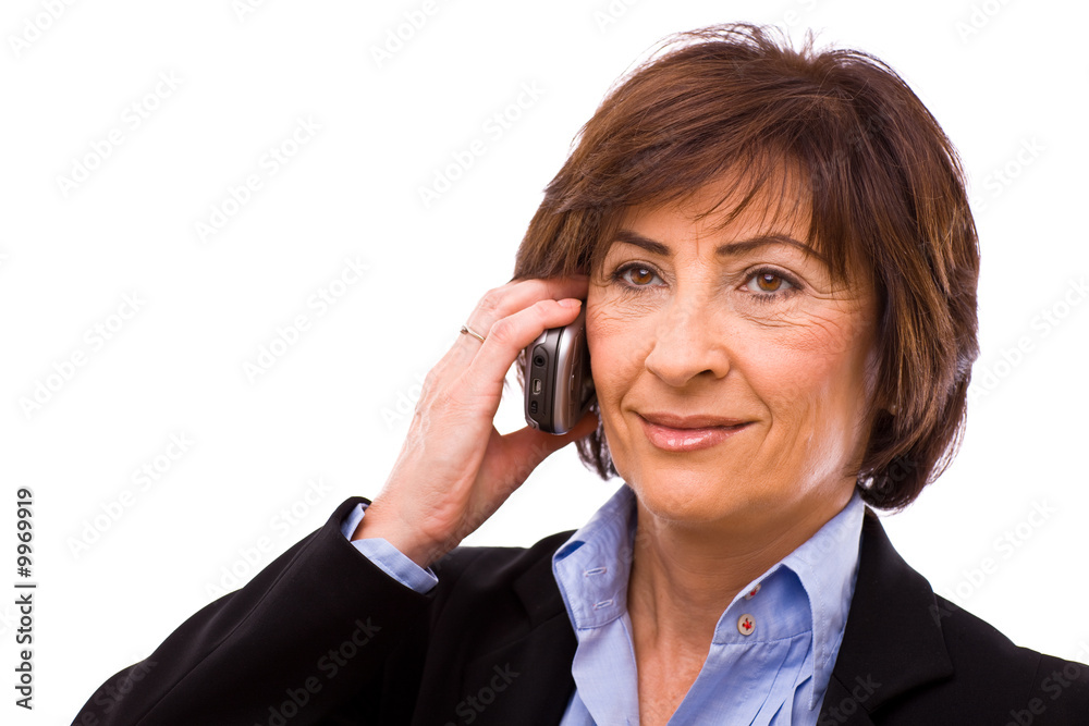 Senior businesswoman calling on mobile phone Senior businesswoman calling on mobile phone