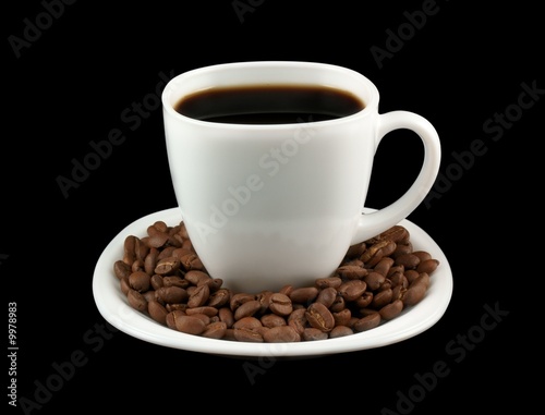 White cup of coffee with coffee grains
