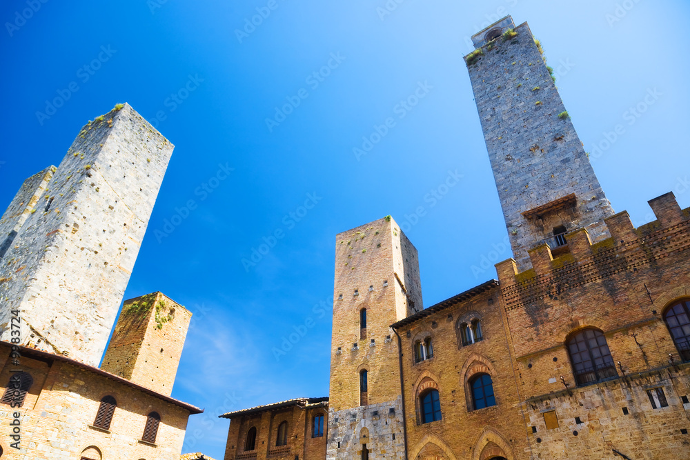 High ancient towers in Italian city. Wide angle view.