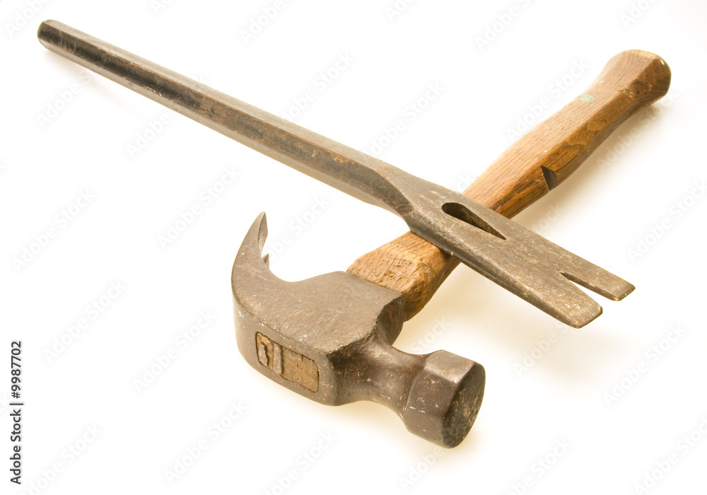 Old steel hammer and worn flat prybar Old steel hammer and worn flat prybar