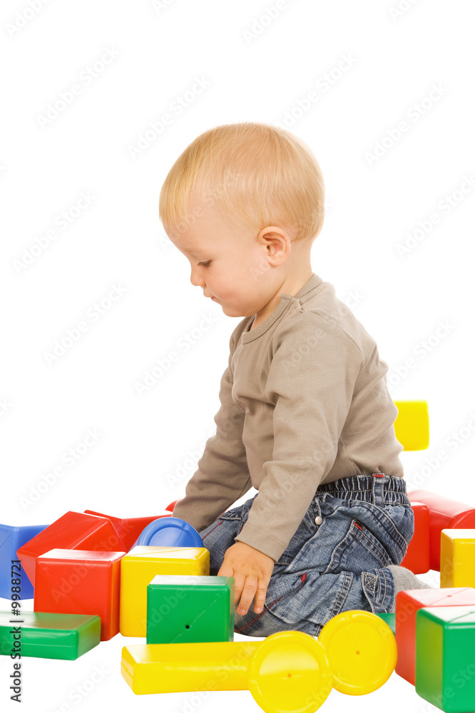 little boy play with bricks. isolated on a white background little boy play with bricks. isolated on a white background