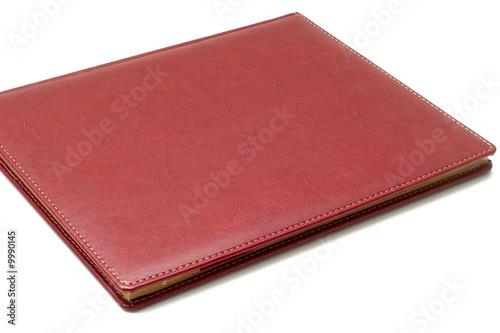 Sold agenda with leather cover on a white background photo