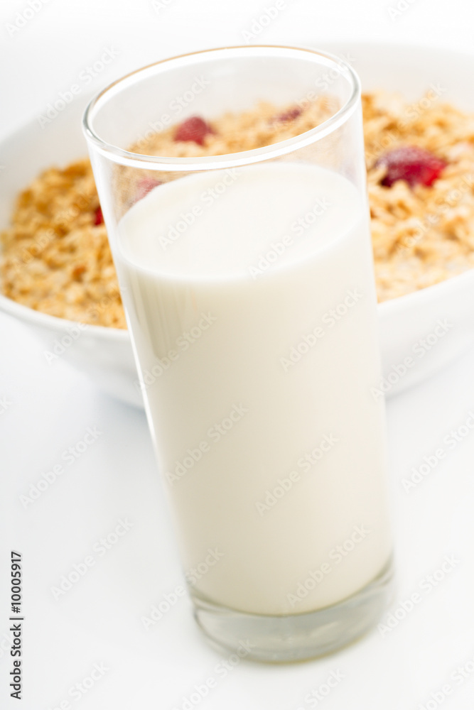 Glass of milk with dish of oat Glass of milk with dish of oat