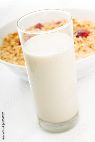 Glass of milk with dish of oat