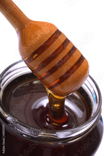 glass of honey on the white background
