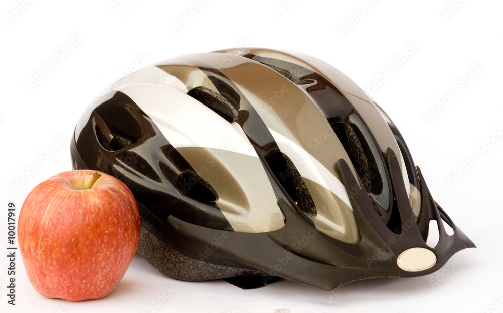 Fototapeta premium Bicycle helmet and apple