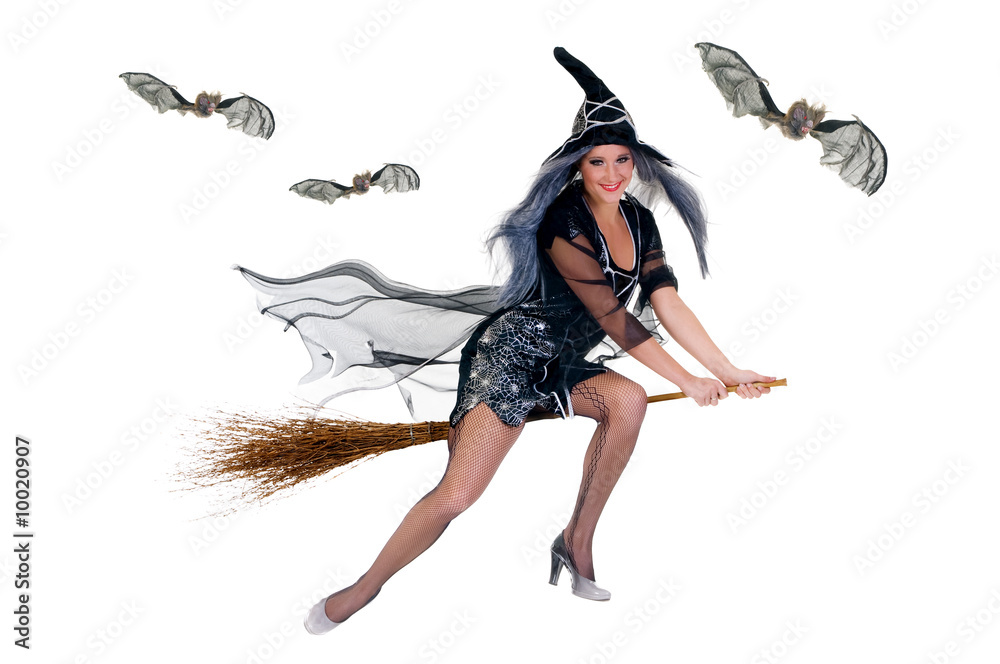 Young attractive Halloween witch flying on broom. Young attractive Halloween witch flying on broom.