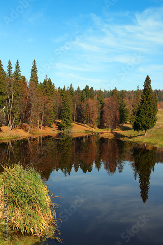 autumn landscape with forest lake in Ural mountains