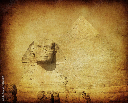 grunge image of sphynx and pyramid photo