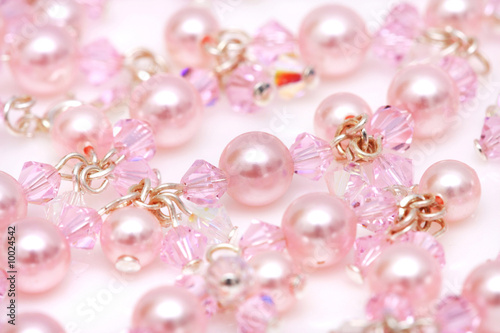 Close up of pink beads of a necklace.