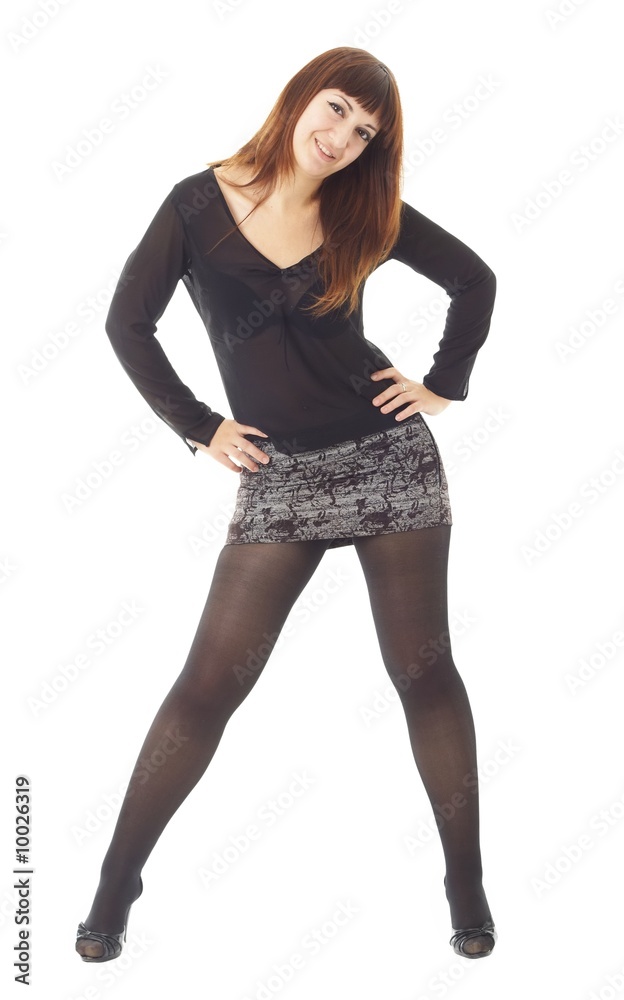 Fototapeta premium young woman standing against isolated white background