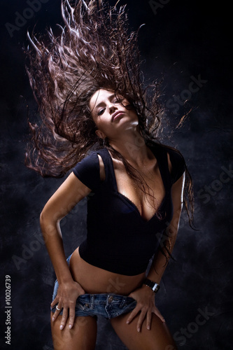 attractive woman dancing, hair flying
