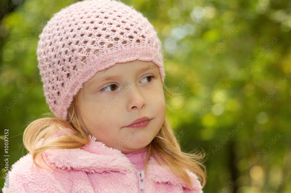 The little girl on walk in park in the autumn The little girl on walk in park in the autumn