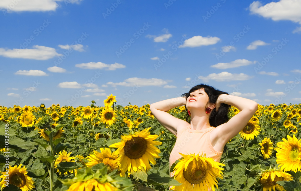 happy woman in the field of sunflowers happy woman in the field of sunflowers