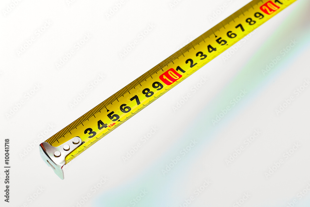 Yellow and black tape measure on white background Yellow and black tape measure on white background