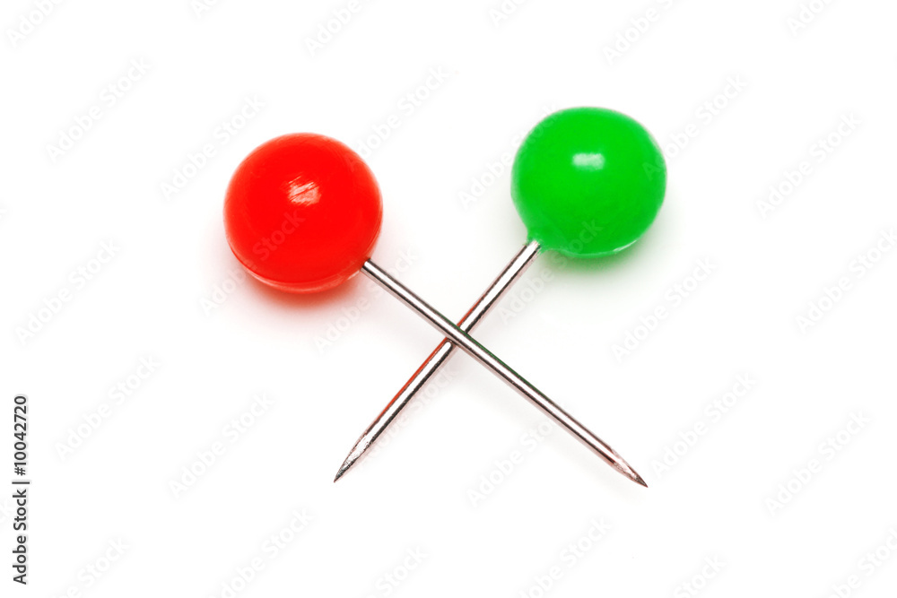Red and green push pins isolated on white background. Red and green push pins isolated on white background.