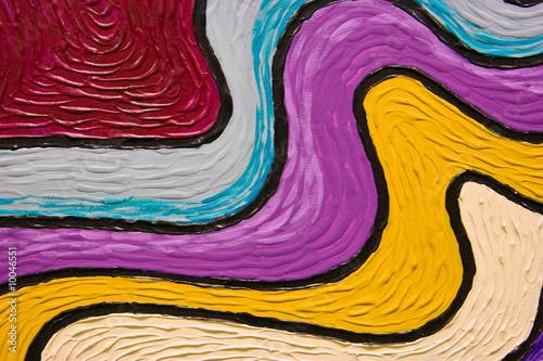 Swooshes of colorful textured paint looking like a rainbow